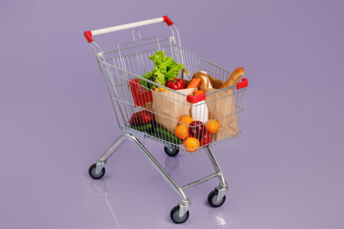 A shopping trolley filled with a selection of groceries