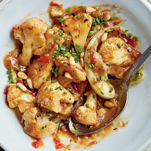 Wok-fried cauliflower with honey soy hoisin and pine nuts