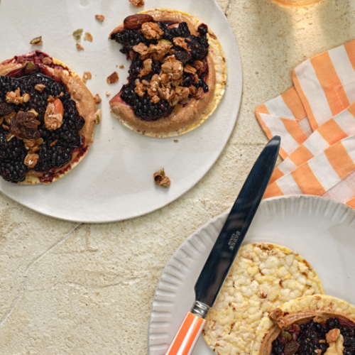 Almond butter, smashed blackberries and granola