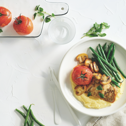 Oregano chicken and mushrooms on creamy polenta